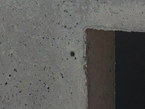 Inset lugs for storm shelter door attachment